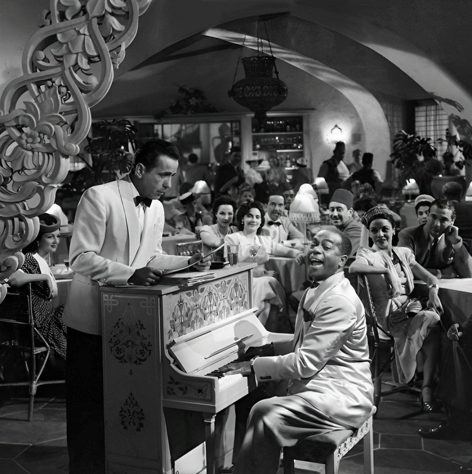 Humphrey Bogart and Dooley Wilson at the piano in a scene from Casablanca (1942)