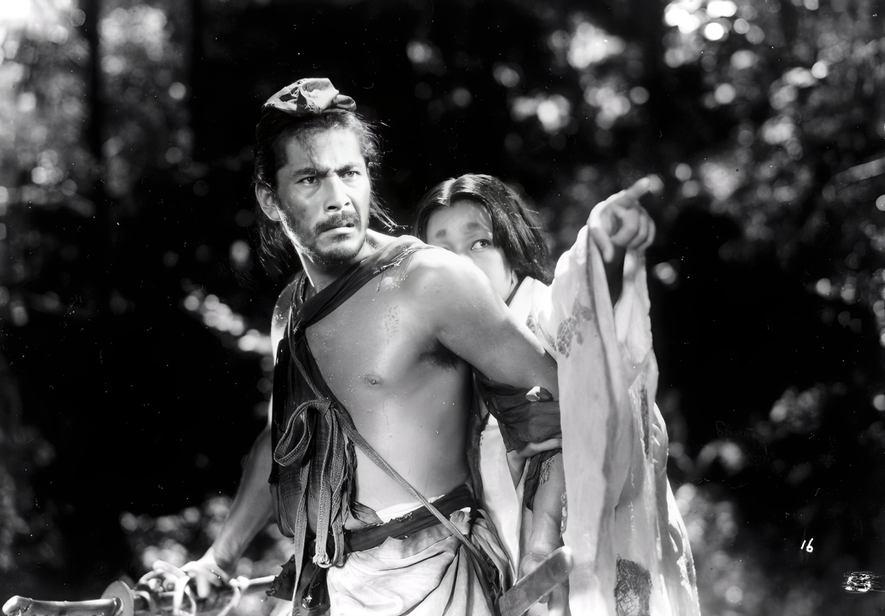 Publicity still from Rashomon (1950): Toshiro Mifune as Tajōmaru with Machiko Kyō, directed by Akira Kurosawa.